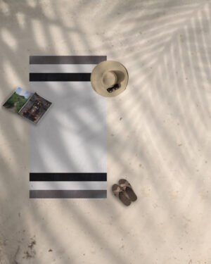 Arzi Beach Towels - The Zephyr (Black & Grey) on the beach