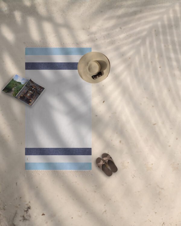 Arzi Beach Towels - The Zephyr (Light Blue & Navy) on the beach