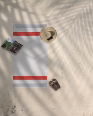 Arzi Beach Towels - The Zephyr (Red & Grey) on the beach