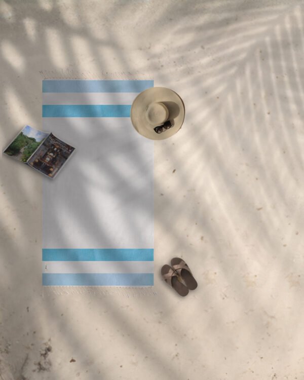 Arzi Beach Towels - The Zephyr (Turquoise & Blue) on the beach