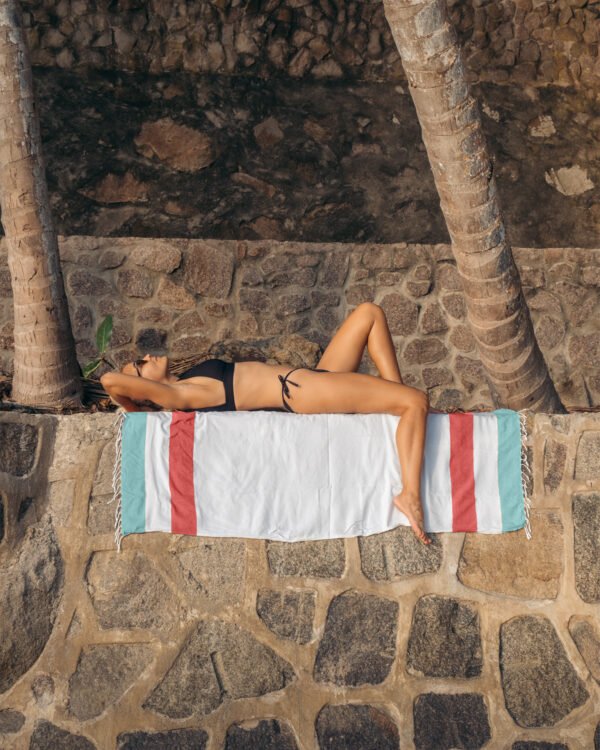 Arzi Beach Towels - The Zephyr (Mint & Red) on the wall